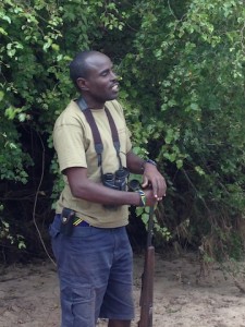 Chagamba with binoculars and gun