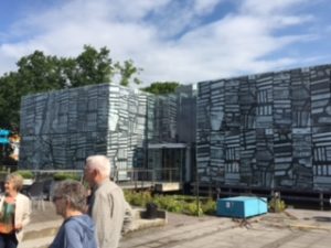 A new visitors center has a map showing the archipelago of islands etched onto the glass of its facade
