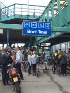 Bikes wait to load on the ferry via their special ramp while....