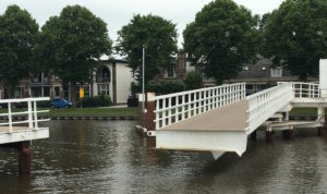 More Dutch engineering: almost all bridges are draw bridges to permit boat and barge navigation. Some are hinged and swing open like a gate as shown here.